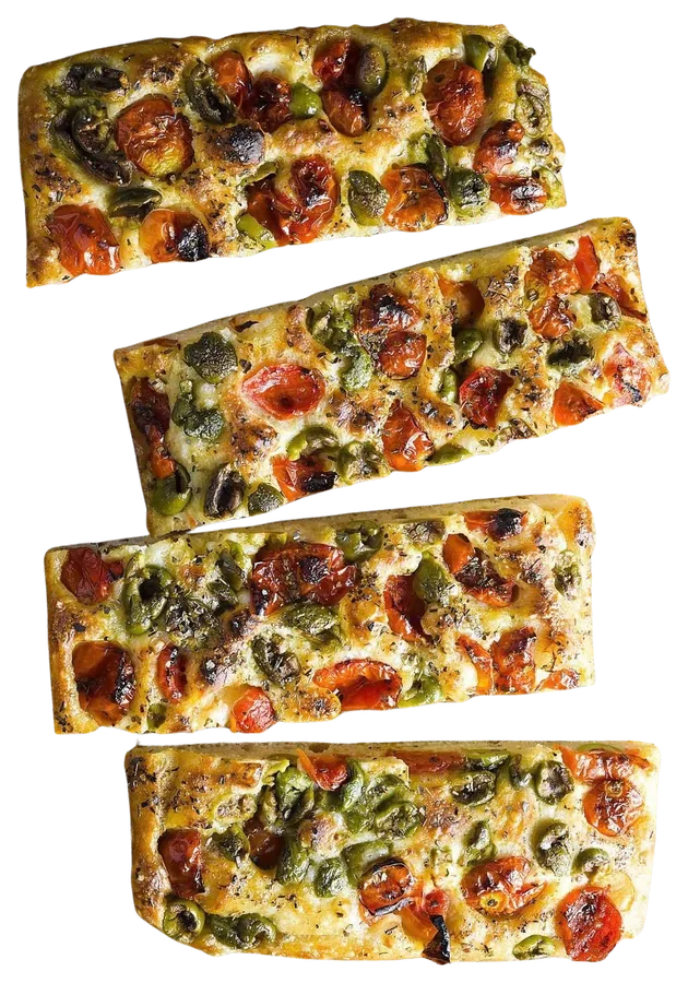 Slices of sourdough focaccia topped with cherry tomatoes and olives